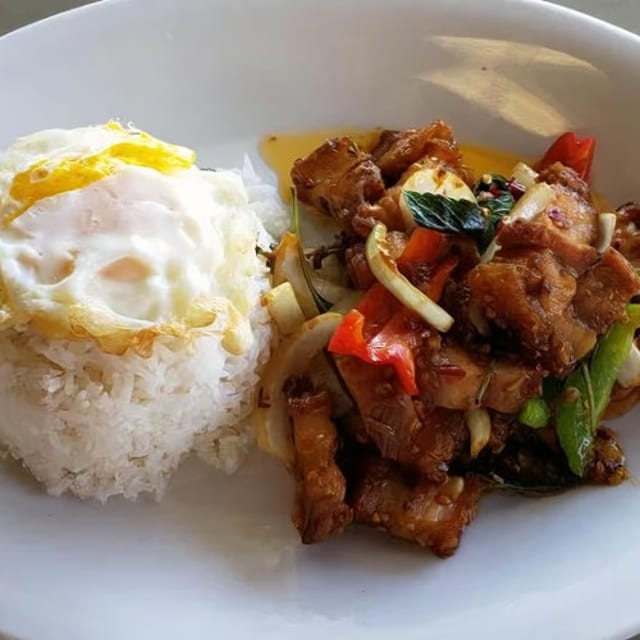 Pad Kaprow Moo Krob kai Dow Over Rice.